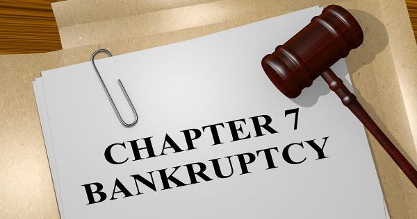 3D illustration of 'CHAPTER 7 BANKRUPTCY' title on legal document